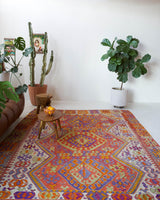 Vintage kilim rug in living room setting, bright colors, wild shaman, soft rug, bold color, Portland, Oregon, rug store, rug shop, local shop, vintage rug, modern kilim, warm colors