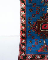 Vintage Turkish runner rug in a living room setting, pile rug, Turkish rug, vintage rug, portland, rug shop, bright colors, wild shaman, soft rug, bold color, Portland, Oregon, rug store, rug shop, local shop, antique rug
