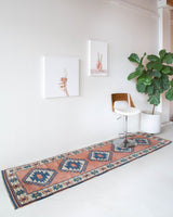 Vintage Turkish runner rug in living room setting, old rug, antique rug, pastel colors, faded colors, Turkish rug, vintage rug, soft rug, Portland, Oregon, rug store, rug shop, local shop