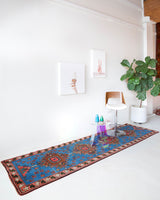 Vintage Turkish runner rug in a living room setting, pile rug, Turkish rug, vintage rug, portland, rug shop, bright colors, wild shaman, soft rug, bold color, Portland, Oregon, rug store, rug shop, local shop, antique rug