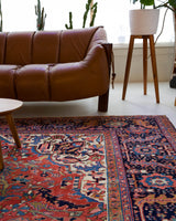 Antique Persian area rug in a living room setting, pile rug, vintage rug, portland, rug shop, bright colors, wild shaman, soft rug, bold color, Portland, Oregon, rug store, rug shop, local shop, antique rug, Persian rug, handmade rug, wool rug