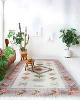 Vintage Turkish rug in living room setting, old rug, antique rug, pastel colors, faded colors, Turkish rug, vintage rug, soft rug, Portland, Oregon, rug store, rug shop, local shopVintage Turkish rug in living room setting, old rug, antique rug, pastel colors, faded colors, Turkish rug, vintage rug, soft rug, Portland, Oregon, rug store, rug shop, local shop
