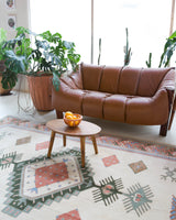 Vintage Turkish rug in living room setting, old rug, antique rug, pastel colors, faded colors, Turkish rug, vintage rug, soft rug, Portland, Oregon, rug store, rug shop, local shop