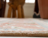 Vintage Turkish rug in living room setting, old rug, antique rug, pastel colors, faded colors, Turkish rug, vintage rug, soft rug, Portland, Oregon, rug store, rug shop, local shop