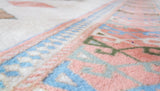 Vintage Turkish rug in living room setting, old rug, antique rug, pastel colors, faded colors, Turkish rug, vintage rug, soft rug, Portland, Oregon, rug store, rug shop, local shop