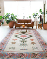 Vintage Turkish rug in living room setting, old rug, antique rug, pastel colors, faded colors, Turkish rug, vintage rug, soft rug, Portland, Oregon, rug store, rug shop, local shop