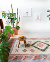 Vintage Turkish rug in living room setting, old rug, antique rug, pastel colors, faded colors, Turkish rug, vintage rug, soft rug, Portland, Oregon, rug store, rug shop, local shop
