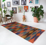 Vintage kilim rug in living room setting, bright colors, wild shaman, soft rug, bold color, Portland, Oregon, rug store, rug shop, local shop, vintage rug, modern kilim, warm colors