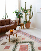 Vintage Turkish rug in living room setting, old rug, antique rug, pastel colors, faded colors, Turkish rug, vintage rug, soft rug, Portland, Oregon, rug store, rug shop, local shop