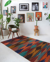 Vintage kilim rug in living room setting, bright colors, wild shaman, soft rug, bold color, Portland, Oregon, rug store, rug shop, local shop, vintage rug, modern kilim, warm colors