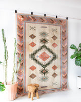 Vintage Turkish rug in living room setting, old rug, antique rug, pastel colors, faded colors, Turkish rug, vintage rug, soft rug, Portland, Oregon, rug store, rug shop, local shop