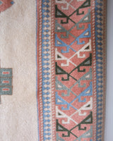 Vintage Turkish rug in living room setting, old rug, antique rug, pastel colors, faded colors, Turkish rug, vintage rug, soft rug, Portland, Oregon, rug store, rug shop, local shop