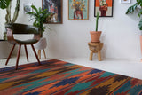 Vintage kilim rug in living room setting, bright colors, wild shaman, soft rug, bold color, Portland, Oregon, rug store, rug shop, local shop, vintage rug, modern kilim, warm colors