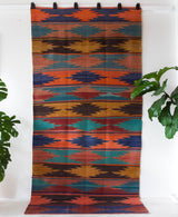 Vintage kilim rug in living room setting, bright colors, wild shaman, soft rug, bold color, Portland, Oregon, rug store, rug shop, local shop, vintage rug, modern kilim, warm colors