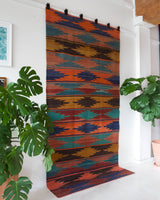 Vintage kilim rug in living room setting, bright colors, wild shaman, soft rug, bold color, Portland, Oregon, rug store, rug shop, local shop, vintage rug, modern kilim, warm colors