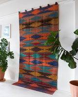 Vintage kilim rug in living room setting, bright colors, wild shaman, soft rug, bold color, Portland, Oregon, rug store, rug shop, local shop, vintage rug, modern kilim, warm colors