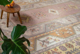 Vintage Turkish rug in living room setting, old rug, antique rug, pastel colors, faded colors, Turkish rug, vintage rug, soft rug, Portland, Oregon, rug store, rug shop, local shop