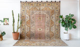Vintage Turkish rug in living room setting, old rug, antique rug, pastel colors, faded colors, Turkish rug, vintage rug, soft rug, Portland, Oregon, rug store, rug shop, local shop