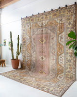 Vintage Turkish rug in living room setting, old rug, antique rug, pastel colors, faded colors, Turkish rug, vintage rug, soft rug, Portland, Oregon, rug store, rug shop, local shop