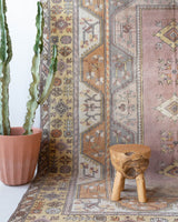 Vintage Turkish rug in living room setting, old rug, antique rug, pastel colors, faded colors, Turkish rug, vintage rug, soft rug, Portland, Oregon, rug store, rug shop, local shop