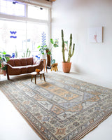 Vintage Turkish rug in living room setting, old rug, antique rug, pastel colors, faded colors, Turkish rug, vintage rug, soft rug, Portland, Oregon, rug store, rug shop, local shop