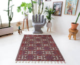 Vintage kilim rug in room decor setting, old rug, antique rug, pastel colors, faded colors, Turkish rug, vintage rug, soft rug, Portland, Oregon, rug store, rug shop, local shop, bold colors, bright colors, faded colors