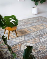 Vintage Turkish rug in living room setting, old rug, antique rug, pastel colors, faded colors, Turkish rug, vintage rug, soft rug, Portland, Oregon, rug store, rug shop, local shop