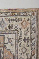 Vintage Turkish rug in living room setting, old rug, antique rug, pastel colors, faded colors, Turkish rug, vintage rug, soft rug, Portland, Oregon, rug store, rug shop, local shop