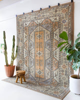 Vintage Turkish rug in living room setting, old rug, antique rug, pastel colors, faded colors, Turkish rug, vintage rug, soft rug, Portland, Oregon, rug store, rug shop, local shop
