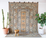 Vintage Turkish rug in living room setting, old rug, antique rug, pastel colors, faded colors, Turkish rug, vintage rug, soft rug, Portland, Oregon, rug store, rug shop, local shop