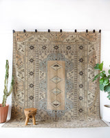 Vintage Turkish rug in living room setting, old rug, antique rug, pastel colors, faded colors, Turkish rug, vintage rug, soft rug, Portland, Oregon, rug store, rug shop, local shop