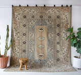 Vintage Turkish rug in living room setting, old rug, antique rug, pastel colors, faded colors, Turkish rug, vintage rug, soft rug, Portland, Oregon, rug store, rug shop, local shop