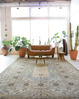 Vintage Turkish rug in living room setting, old rug, antique rug, pastel colors, faded colors, Turkish rug, vintage rug, soft rug, Portland, Oregon, rug store, rug shop, local shop
