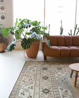 Vintage Turkish rug in living room setting, old rug, antique rug, pastel colors, faded colors, Turkish rug, vintage rug, soft rug, Portland, Oregon, rug store, rug shop, local shop