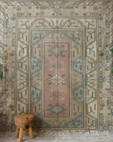 Vintage Turkish rug in living room setting, old rug, antique rug, pastel colors, faded colors, Turkish rug, vintage rug, soft rug, Portland, Oregon, rug store, rug shop, local shop