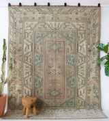 Vintage Turkish rug in living room setting, old rug, antique rug, pastel colors, faded colors, Turkish rug, vintage rug, soft rug, Portland, Oregon, rug store, rug shop, local shop