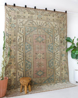 Vintage Turkish rug in living room setting, old rug, antique rug, pastel colors, faded colors, Turkish rug, vintage rug, soft rug, Portland, Oregon, rug store, rug shop, local shop