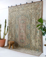 Vintage Turkish rug in living room setting, old rug, antique rug, pastel colors, faded colors, Turkish rug, vintage rug, soft rug, Portland, Oregon, rug store, rug shop, local shop