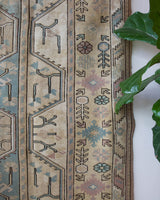 Vintage Turkish rug in living room setting, old rug, antique rug, pastel colors, faded colors, Turkish rug, vintage rug, soft rug, Portland, Oregon, rug store, rug shop, local shop