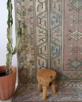 Vintage Turkish rug in living room setting, old rug, antique rug, pastel colors, faded colors, Turkish rug, vintage rug, soft rug, Portland, Oregon, rug store, rug shop, local shop