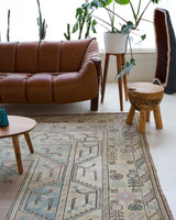Vintage Turkish rug in living room setting, old rug, antique rug, pastel colors, faded colors, Turkish rug, vintage rug, soft rug, Portland, Oregon, rug store, rug shop, local shop