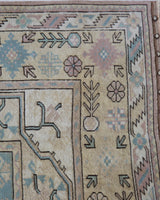 Vintage Turkish rug in living room setting, old rug, antique rug, pastel colors, faded colors, Turkish rug, vintage rug, soft rug, Portland, Oregon, rug store, rug shop, local shop