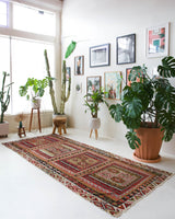 Vintage kilim rug in living room setting, old rug, antique rug, pastel colors, faded colors, Turkish rug, vintage rug, soft rug, Portland, Oregon, rug store, rug shop, local shop, earthy tones, earthy colors, warm colors