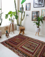 Vintage kilim rug in living room setting, old rug, antique rug, pastel colors, faded colors, Turkish rug, vintage rug, soft rug, Portland, Oregon, rug store, rug shop, local shop, earthy tones, earthy colors, warm colors