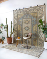 Vintage Turkish rug in living room setting, old rug, antique rug, pastel colors, faded colors, Turkish rug, vintage rug, soft rug, Portland, Oregon, rug store, rug shop, local shop