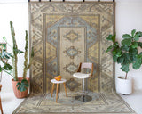 Vintage Turkish rug in living room setting, old rug, antique rug, pastel colors, faded colors, Turkish rug, vintage rug, soft rug, Portland, Oregon, rug store, rug shop, local shop