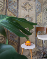 Vintage Turkish rug in living room setting, old rug, antique rug, pastel colors, faded colors, Turkish rug, vintage rug, soft rug, Portland, Oregon, rug store, rug shop, local shop