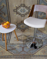 Vintage Turkish rug in living room setting, old rug, antique rug, pastel colors, faded colors, Turkish rug, vintage rug, soft rug, Portland, Oregon, rug store, rug shop, local shop