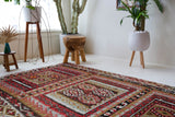 Vintage kilim rug in living room setting, old rug, antique rug, pastel colors, faded colors, Turkish rug, vintage rug, soft rug, Portland, Oregon, rug store, rug shop, local shop, earthy tones, earthy colors, warm colors