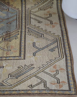 Vintage Turkish rug in living room setting, old rug, antique rug, pastel colors, faded colors, Turkish rug, vintage rug, soft rug, Portland, Oregon, rug store, rug shop, local shop